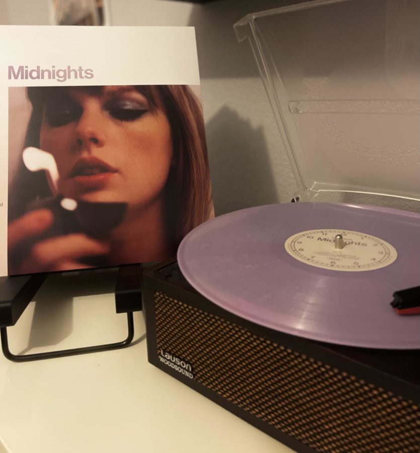 The+Midnights+Lavender+Edition+vinyl+on+a+record+player+and+sleeve+at+a+students+home+on+February+13%2C+2023.++