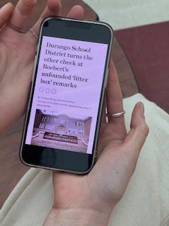 A student reading an article about Lauren Boeberts claims about litter boxes at Durango schools on March 15, 2023. 