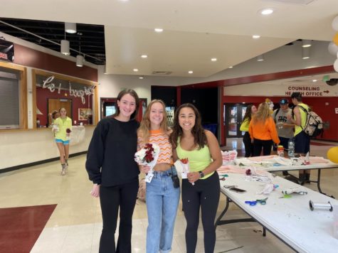 Aislinn Jordan, Olivia Beacher, and Rachel Minor in the commons. These girls arranged and tied flowers together for their fellow student council members to deliver last Friday October 7th at DHS.

