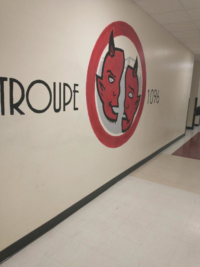 The+Troupe+1096+logo+in+the+DHS+theater+hall%2C+December+12th%2C+2022.+