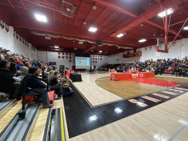 The gym at DHS is filled with 8th grade students and parents on Monday, January 27, 2025. The night was for incoming freshmen and their families to explore DHS and learn about clubs, classes, and sports