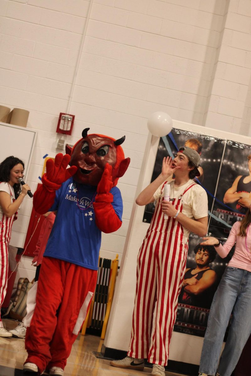 The Demon Mascot pumps up students at the annual Wish Week Assembly on Friday, February 28, 2025. The goal of the assembly was to show support for Berkeley, this year’s Wish Week kid. Her wish was to go to Disney World, and throughout the week, DHS students raised money to help grant her wish. 
