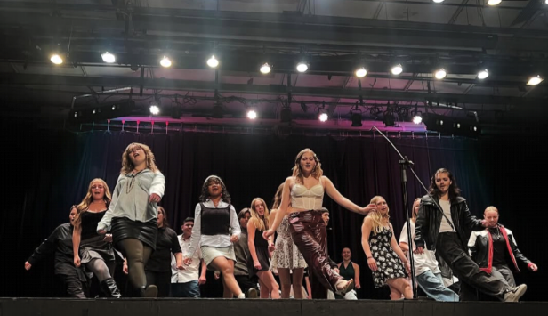 Here is concert choir dancing and singing the song Uptown girl by Billy Joel