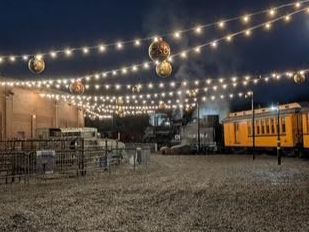 The train yard for the Polar Express is decorated for the holiday season.
